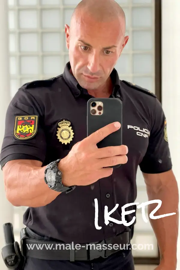 Iker gay masseur in Ibiza in his real Policeman uniform